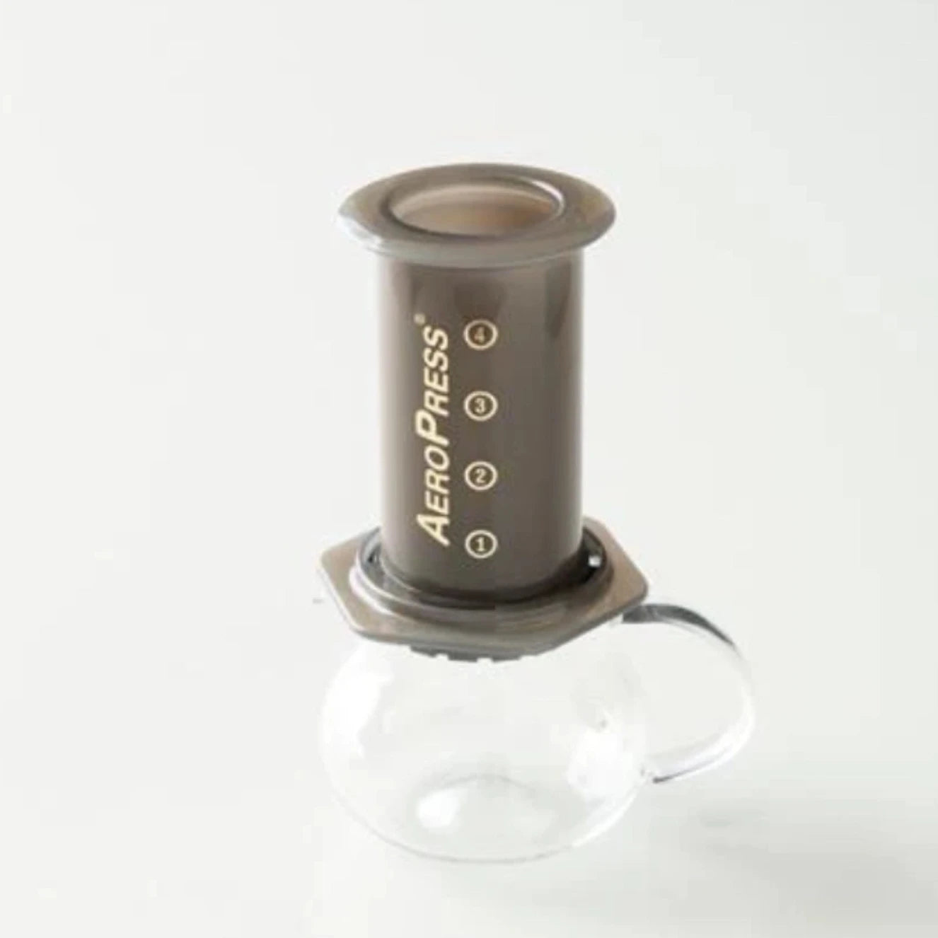 Showing ORIGAMI Pinot Aroma Coffee Server fitting on an AeroPress tube device