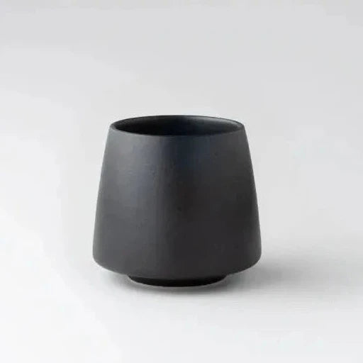 A matte black ORIGAMI Aroma flavor Cup