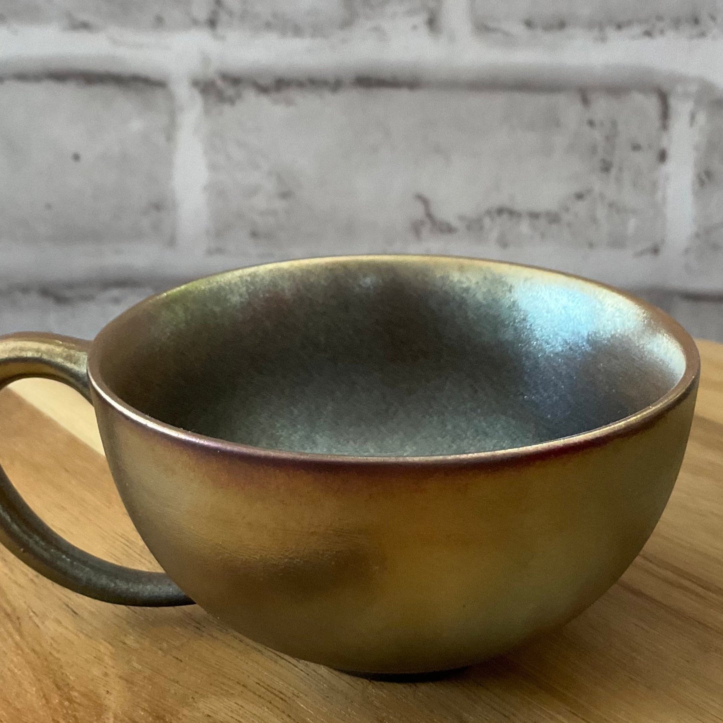 Different Angle to Show the Unique Color Luster of the Wabi-Sabi Green-Golden Wood-Fired Ceramic Latte Cup