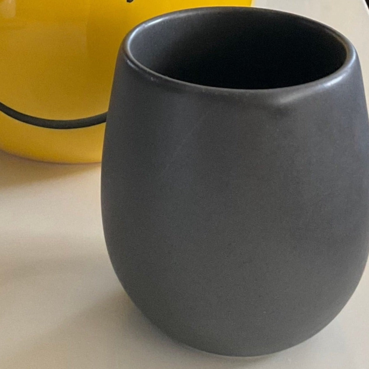 A matte black ORIGAMI Barrel Flavor Cup