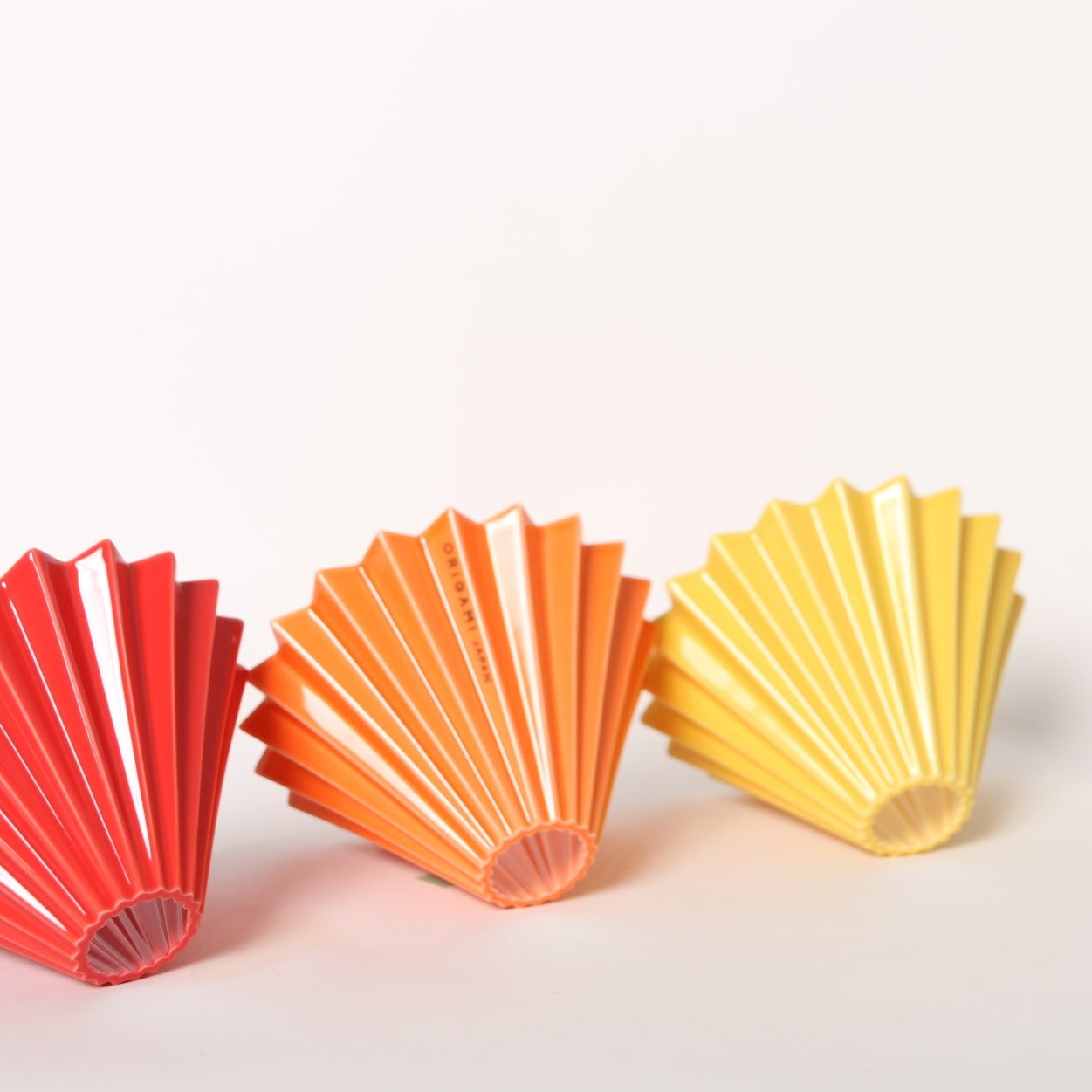 Red, Orange, Yellow ORIGAMI Coffee Drippers in a row