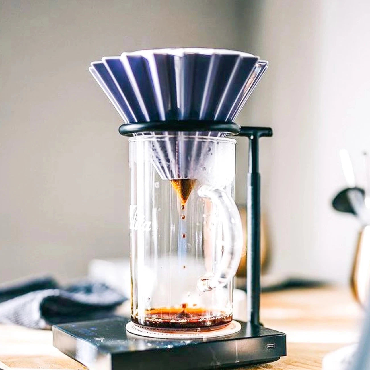 Using ORIGAMI coffee dripper brewing pour-over coffee