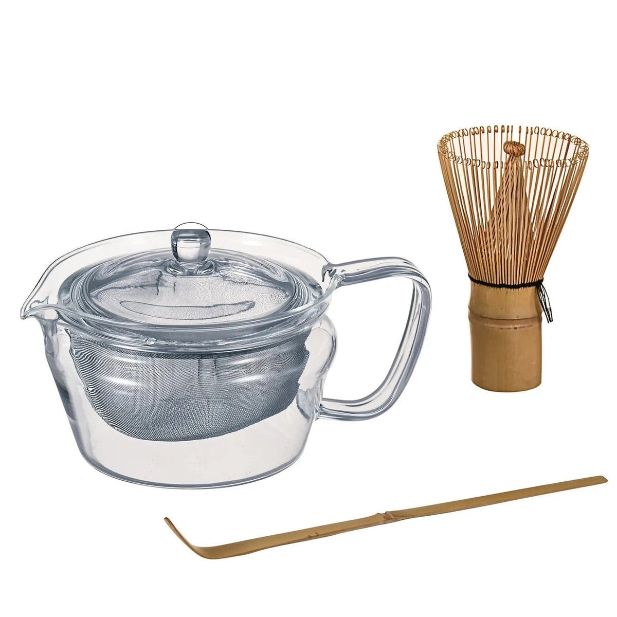 A clear glass teapot with a lid, handle, and built-in mesh strainer, shown alongside a bamboo whisk and bamboo scoop on a plain white background.