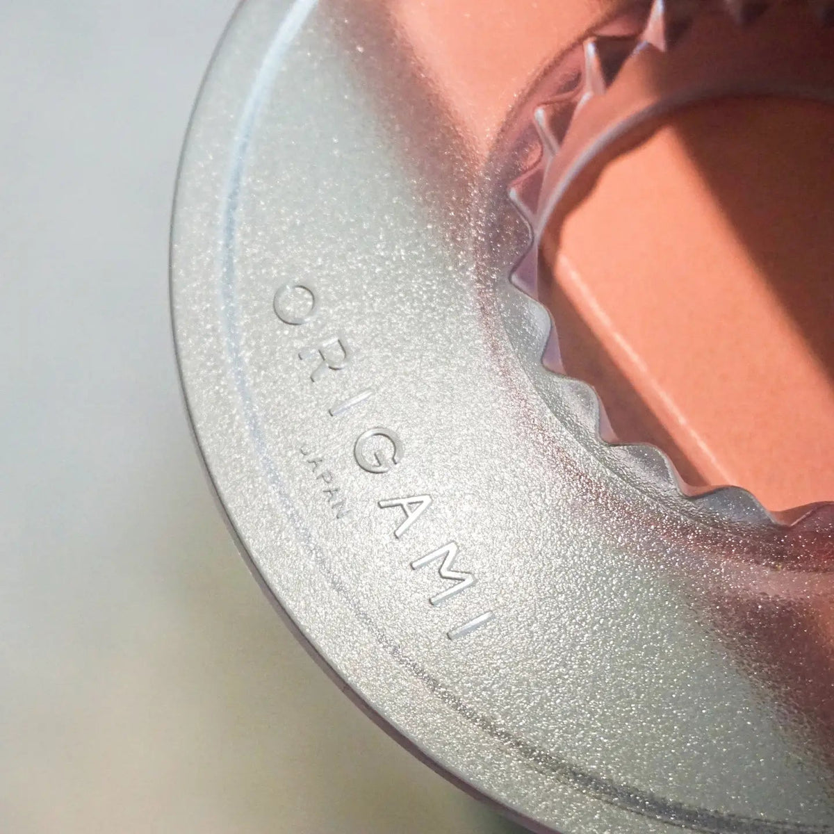 A closer look of clear color ORIGAMI AS Resin Dripper Holder, there is "ORIGAMI Japan" trademark on it