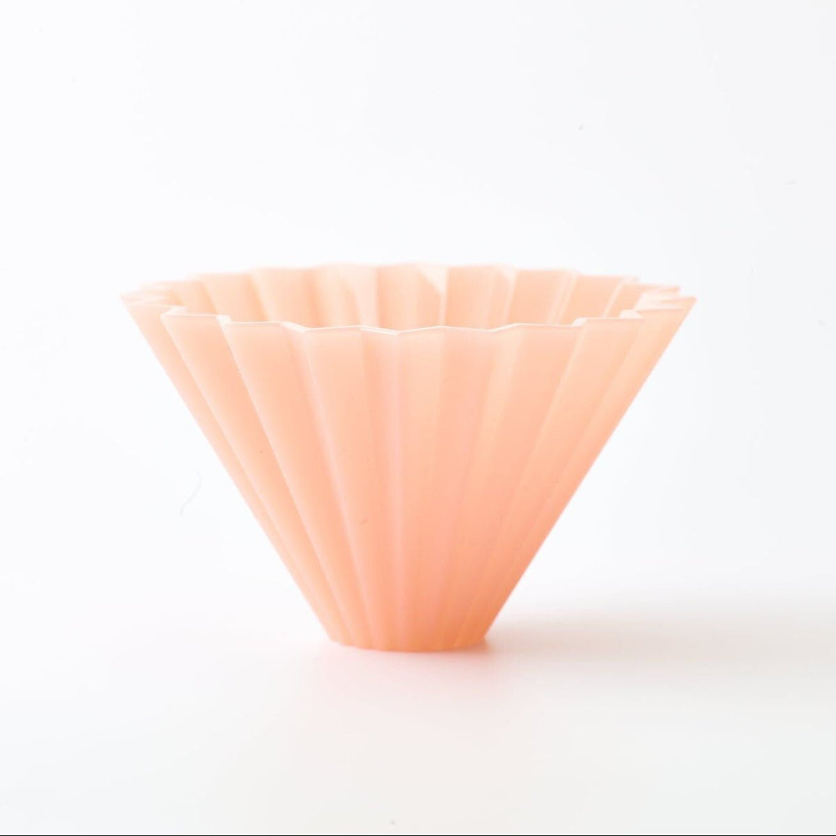 A 20 rib, silicone coffee dripper in matte pink color shown on a clean white background.