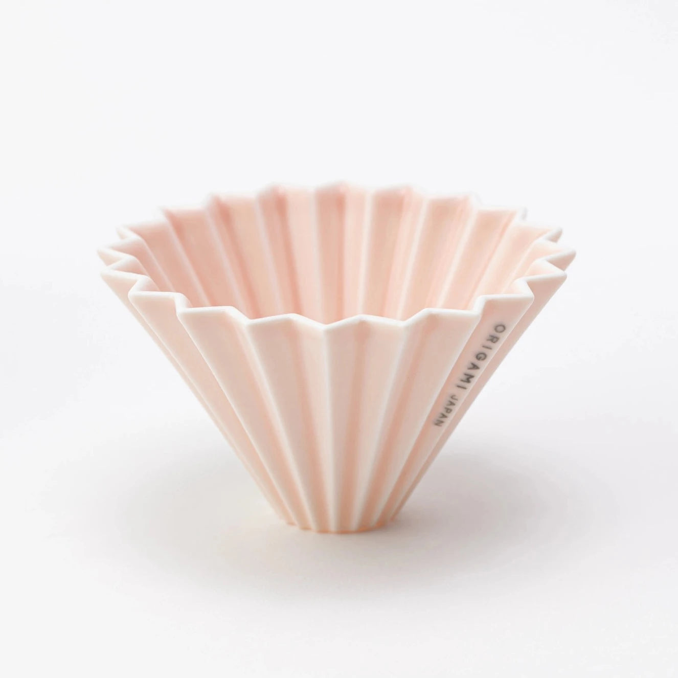 A matte pink ORIGAMI Coffee Dripper S