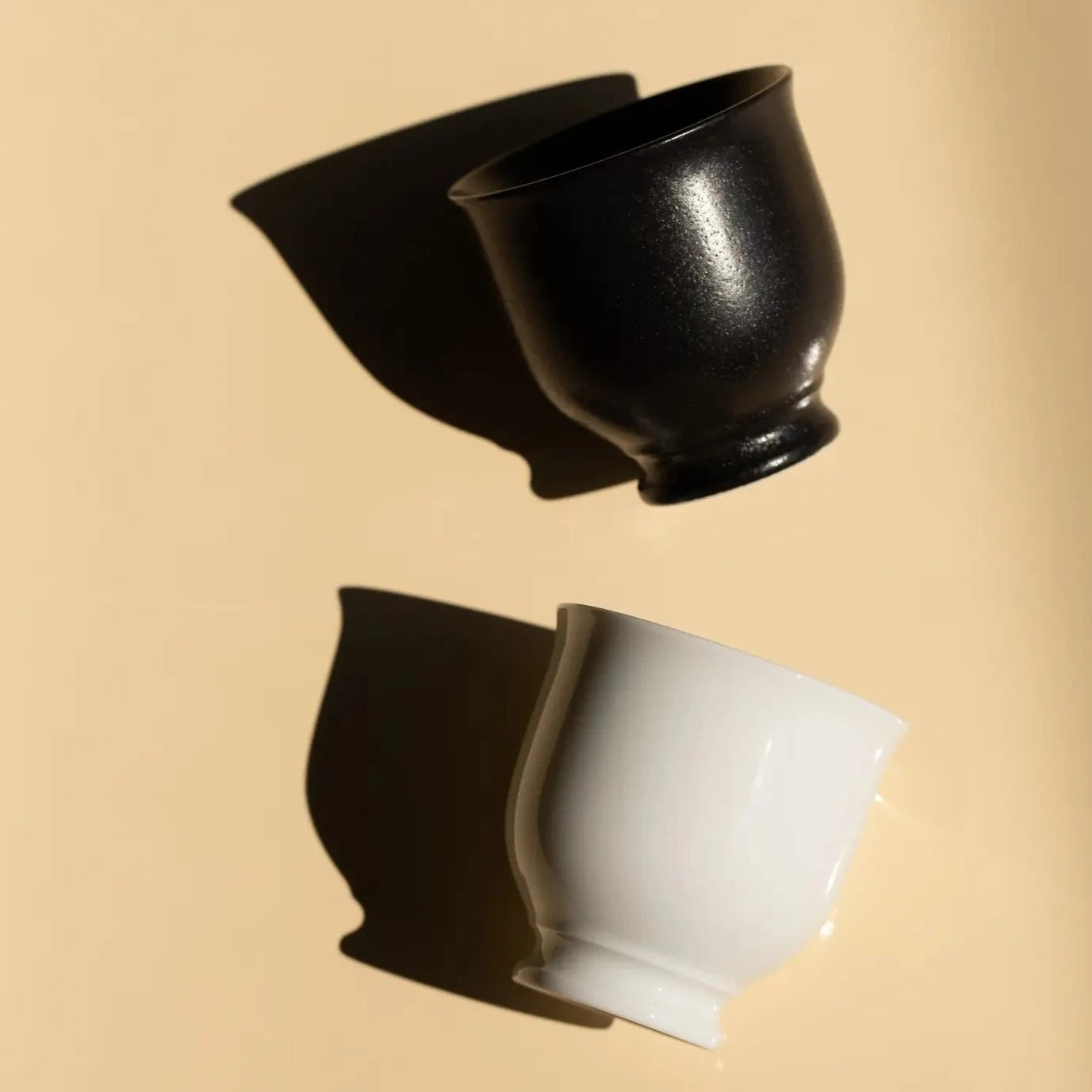 A black and a white ORIGAMI Sensory Filter Cup