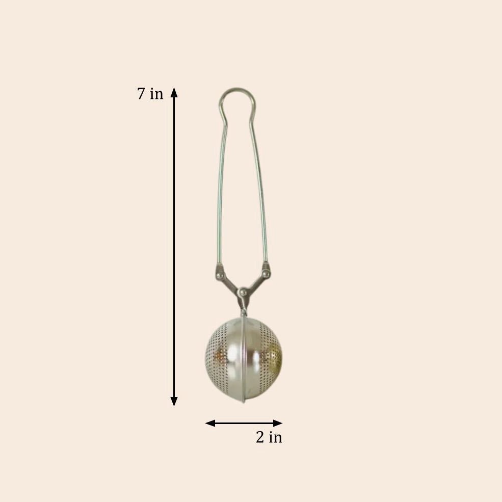 A silver stainless steel tea strainer